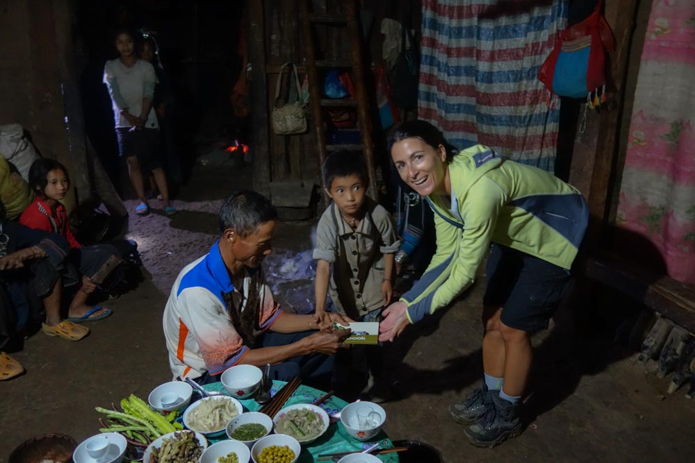 Day 1 trek - Moni giving the present to the Chief