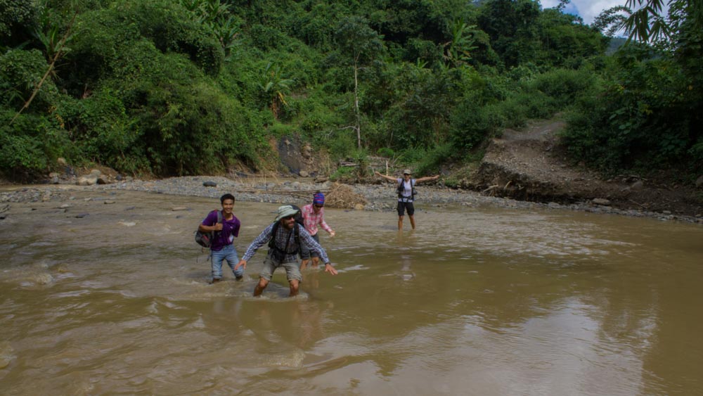 Day 1 trek - the team crossing the very very dangerous river