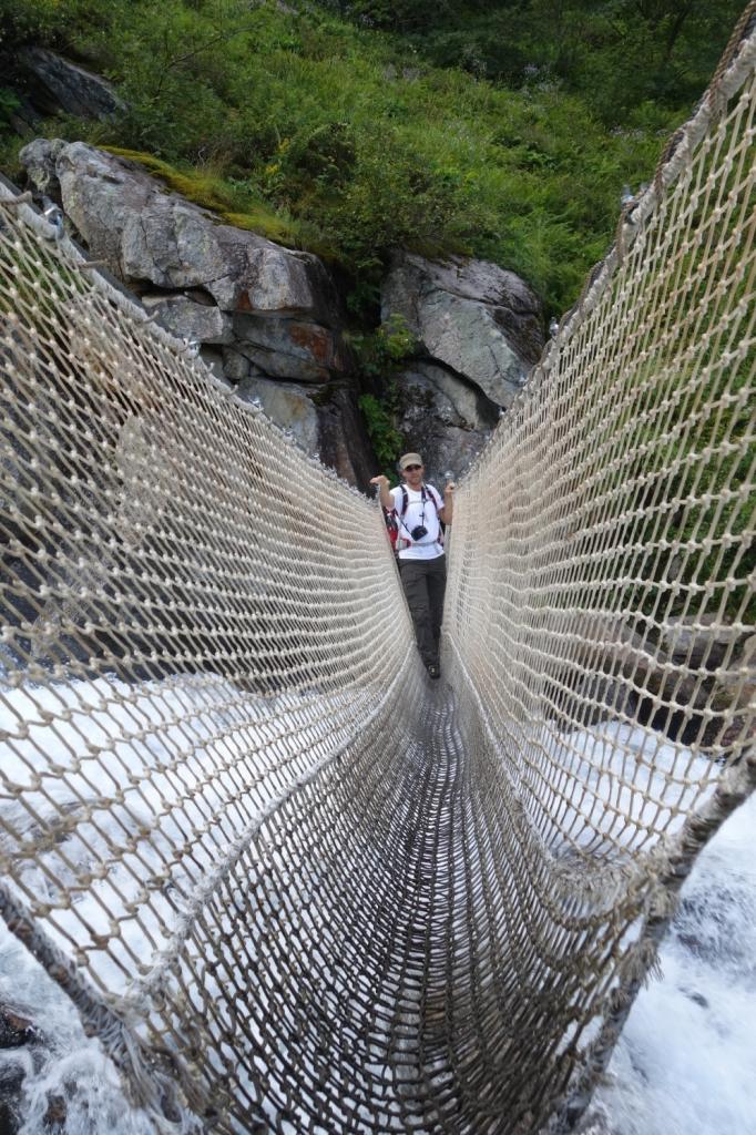 Crossing a waterfall on the way to Lac Bleu