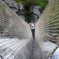 Crossing a waterfall on the way to Lac Bleu