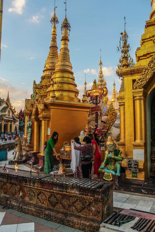 Buddhists performing rituals at Shwedagon Pagoda