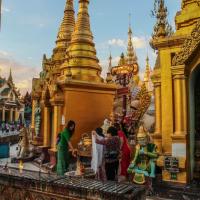 Buddhists performing rituals at Shwedagon Pagoda