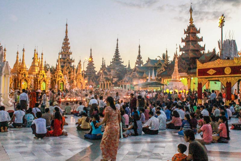 Buddhists performing rituals at Shwedagon Pagoda