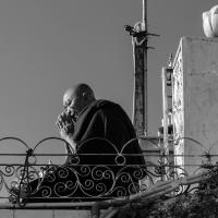 Monk praying at Golden Rock