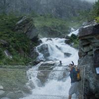 Crossing a waterfall on the way to Lac Bleu