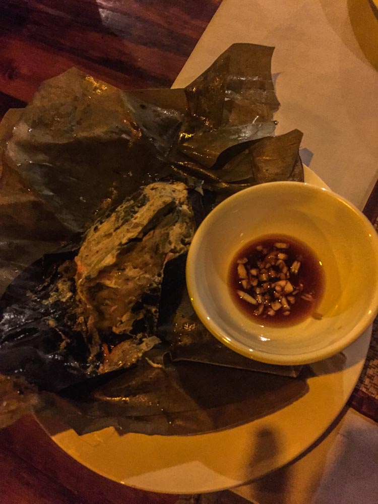 Steamed fish in banana leaves